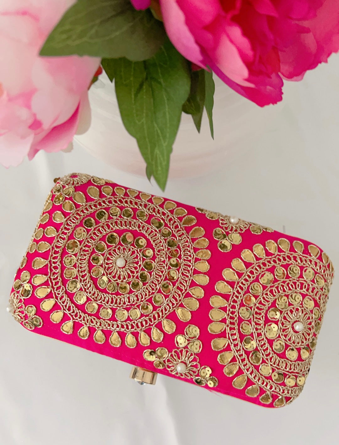 Pink sales gold clutch